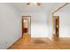 Spacious room showcasing hardwood floors and access to the bathroom and other rooms at 218 Forestville Rd, Wake Forest, NC 27587