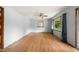 Bright living room featuring hardwood floors, a ceiling fan, and ample natural light at 218 Forestville Rd, Wake Forest, NC 27587