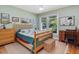 Cozy bedroom with natural light, featuring hardwood floors and traditional furnishings at 224 Kirkwood Dr, Chapel Hill, NC 27514