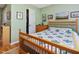 Well-lit bedroom with light green walls, hardwood floors, and a comfortable bed at 224 Kirkwood Dr, Chapel Hill, NC 27514