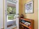 Covered entryway features outdoor access, a wooden shelf, and art at 224 Kirkwood Dr, Chapel Hill, NC 27514