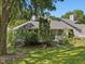 Home exterior view with a well-maintained lawn and lush green foliage at 224 Kirkwood Dr, Chapel Hill, NC 27514