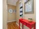 Hallway with red table and unique artwork creating an inviting and stylish space at 224 Kirkwood Dr, Chapel Hill, NC 27514