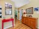 Charming hallway with hardwood floors, bright walls, and decorative artwork at 224 Kirkwood Dr, Chapel Hill, NC 27514