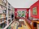 Inviting living room featuring hardwood floors, a large window, and custom built-in bookshelves at 224 Kirkwood Dr, Chapel Hill, NC 27514