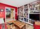 Spacious living room with hardwood floors and custom built-in bookshelves for ample storage at 224 Kirkwood Dr, Chapel Hill, NC 27514