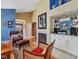 Stylish living area with a fireplace, built-in bar, and open layout that connects to other living spaces at 224 Kirkwood Dr, Chapel Hill, NC 27514