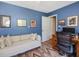 Office space with a cozy couch, workspace, and natural light, creating an inviting area at 224 Kirkwood Dr, Chapel Hill, NC 27514