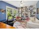 Bright office with custom built-in bookshelves and a large window overlooking the greenery at 224 Kirkwood Dr, Chapel Hill, NC 27514