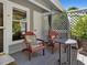 Cozy outdoor porch with comfortable seating and decorative lattice at 224 Kirkwood Dr, Chapel Hill, NC 27514