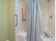 Bathroom view of a shower featuring a striped shower curtain and grab bar at 224 Kirkwood Dr, Chapel Hill, NC 27514
