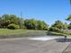Well-maintained community tennis court surrounded by trees and a chain-link fence at 224 Kirkwood Dr, Chapel Hill, NC 27514