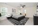 Stylish bedroom featuring neutral décor, a ceiling fan, and ample space at 2241 Spruce Shadows Ln, Raleigh, NC 27614