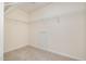 Walk-in closet with wire shelving and neutral carpet flooring at 2241 Spruce Shadows Ln, Raleigh, NC 27614