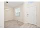 Bright entryway featuring a neutral color palette and modern lighting fixture at 2241 Spruce Shadows Ln, Raleigh, NC 27614