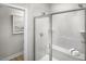 Sleek bathroom with a glass-enclosed shower, tiled walls, and built-in bench at 2353 Stephens Pass Sta, Apex, NC 27502