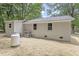 Exterior of house featuring a backyard with fresh straw, utilities, and a brick foundation at 2702 Red Valley Dr, Rougemont, NC 27572