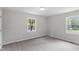 Bedroom featuring neutral walls, carpet, and multiple windows allowing natural light at 2702 Red Valley Dr, Rougemont, NC 27572