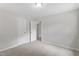 Bedroom with neutral walls, carpet, and doors leading to the hallway at 2702 Red Valley Dr, Rougemont, NC 27572