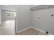 Laundry room featuring washer and dryer hookups, shelving and natural light at 2702 Red Valley Dr, Rougemont, NC 27572