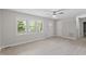 Bright living room featuring large windows, a ceiling fan, and neutral flooring at 2702 Red Valley Dr, Rougemont, NC 27572