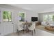 Bright living room with natural light, hardwood floors and a cozy dining area offers a welcoming space at 2702 Red Valley Dr, Rougemont, NC 27572