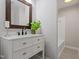 Elegant bathroom boasts a marble countertop, sleek black faucet, and decorative mirror at 2905 Scuppernong Ln, Durham, NC 27703