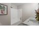 Bright bathroom features a shower-tub with white tile surround and a marble countertop sink at 2905 Scuppernong Ln, Durham, NC 27703