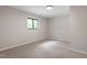 Bedroom featuring plush carpet, a modern light fixture and natural light at 2905 Scuppernong Ln, Durham, NC 27703