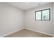 Small bedroom with neutral paint offers lots of natural light at 2905 Scuppernong Ln, Durham, NC 27703