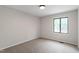 Bedroom featuring plush carpet, a window and neutral walls at 2905 Scuppernong Ln, Durham, NC 27703