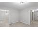 Neutral dining room featuring stylish lighting fixtures and adjacent rooms at 2905 Scuppernong Ln, Durham, NC 27703
