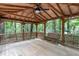 Interior of a gazebo with a wooden ceiling fan and a bench at 2905 Scuppernong Ln, Durham, NC 27703