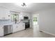 Stylish kitchen featuring modern appliances, white cabinetry, and hardwood flooring at 2905 Scuppernong Ln, Durham, NC 27703