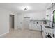 Spacious kitchen with white cabinets, modern appliances, and ample storage at 2905 Scuppernong Ln, Durham, NC 27703