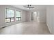 Bright living room with large windows and modern ceiling fan offers plenty of natural light at 2905 Scuppernong Ln, Durham, NC 27703