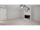 Cozy living room with fireplace and modern ceiling fan, perfect for relaxing at 2905 Scuppernong Ln, Durham, NC 27703