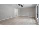 Bright, spacious living room with neutral walls, ceiling fan, and large window at 2905 Scuppernong Ln, Durham, NC 27703