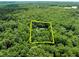 Aerial view of a secluded estate surrounded by a lush green forest at 300 Oak Ridge Dr, Hillsborough, NC 27278