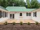Spacious backyard with wooden deck and beautiful landscaping at 300 Oak Ridge Dr, Hillsborough, NC 27278