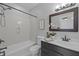 Well-lit bathroom with a shower-tub combination, vanity, and toilet at 300 Oak Ridge Dr, Hillsborough, NC 27278