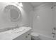 Bright bathroom showcasing a vanity, decorative mirror, and a shower-tub combination at 300 Oak Ridge Dr, Hillsborough, NC 27278