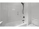 Bathroom with a bathtub-shower combination and toilet on a white floor at 300 Oak Ridge Dr, Hillsborough, NC 27278