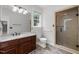 Bathroom featuring a wood vanity, large mirror, and glass shower at 300 Oak Ridge Dr, Hillsborough, NC 27278
