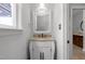 Elegant bathroom featuring white vanity, granite countertop, framed mirror, and soft lighting at 300 Oak Ridge Dr, Hillsborough, NC 27278
