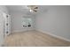 Bedroom with light hardwood floors, a window, and ceiling fan at 300 Oak Ridge Dr, Hillsborough, NC 27278