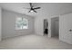 Spacious bedroom with a ceiling fan, window, and access to a bathroom and closet at 300 Oak Ridge Dr, Hillsborough, NC 27278
