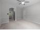 Empty bedroom with an arched doorway and a window offering plenty of natural light at 300 Oak Ridge Dr, Hillsborough, NC 27278