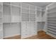 Spacious walk-in closet with custom shelving, drawers, and ample storage for organization at 300 Oak Ridge Dr, Hillsborough, NC 27278