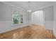 Bright dining room features a modern chandelier, detailed trim work, and large windows providing ample natural light at 300 Oak Ridge Dr, Hillsborough, NC 27278